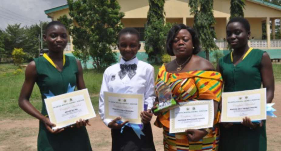 The Three students who excelled in the 2016 B.E.C.E with their former headmistress. From left Selina Antwi, Theodore Kwatey, Madam Beatrice Adoh Headmistress and Proprietress of Platinum Montessori School and Nyira Maison.