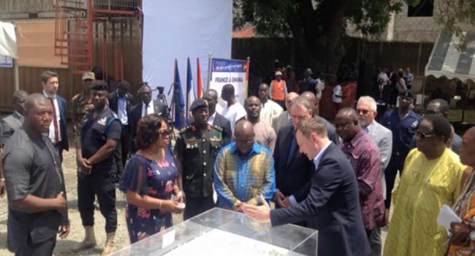 President Akufo-Addo being shown the proposed building design