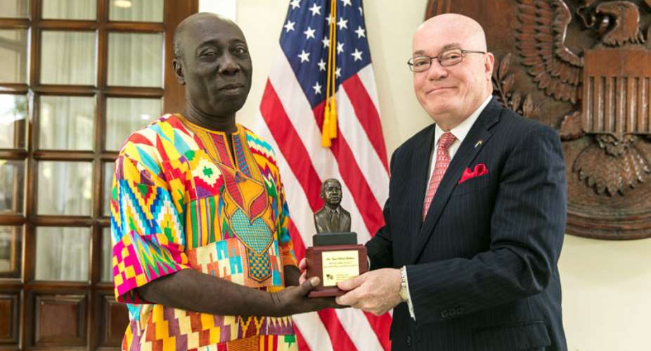 Ambassador Jackson presented the plaque to Mr. Yaw Ofori Debrah