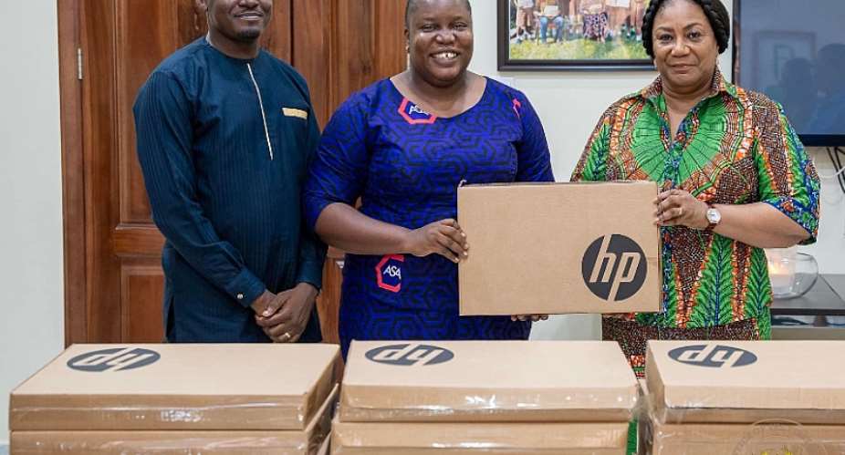 First Lady, Rebecca Akufo-Addoright, presenting the laptops to the schools