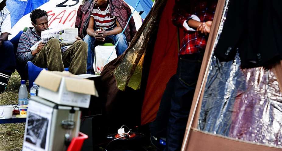 Iraqi, Iranian and Somali asylum seekers at a tent camp in the Netherlands - Source: ROBIN UTRECHTAFPGettyImages