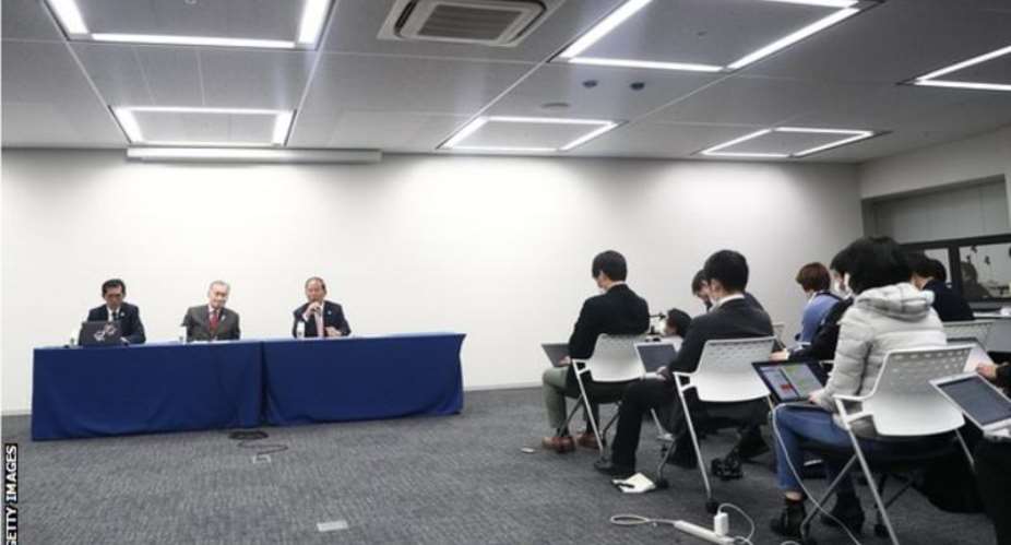 Tokyo 2020 president Yoshiro Mori centre, at table made the announcement at a news conference on Monday
