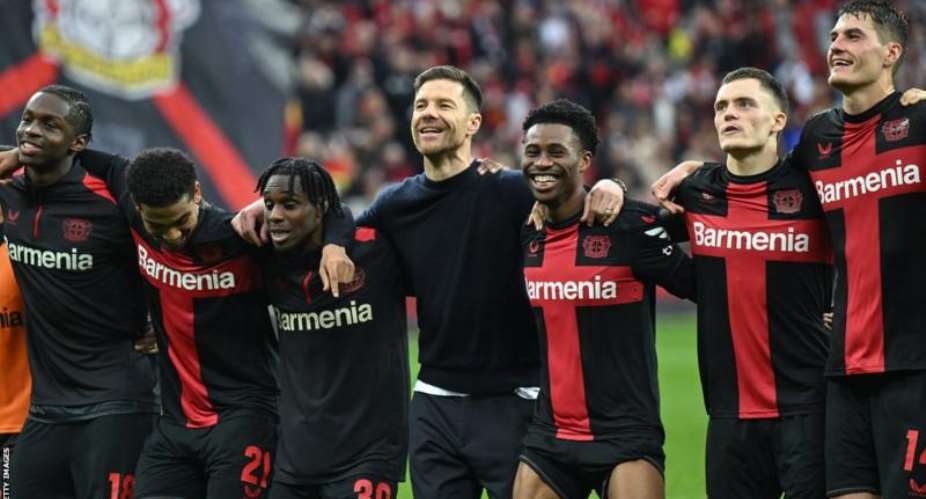 Leverkusen were playing their first match since manager Xabi Alonso (centre) announced he will stay at the club next season