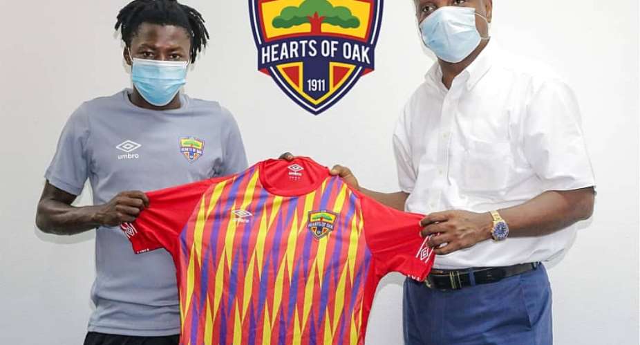 Hearts of Oak board chairman Togbe Afede XIV Right, with new signing Salifu Ibrahim Left