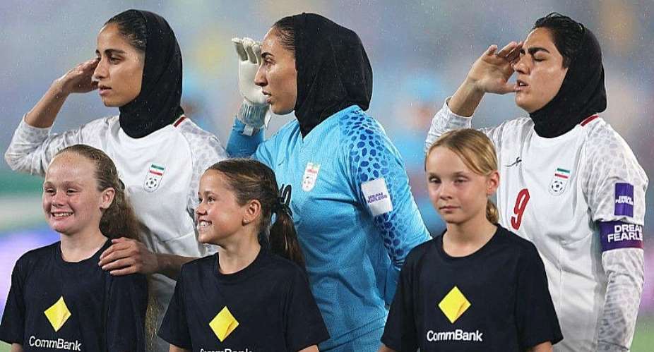 Getty ImagesImage caption: Some supporters booed as the Iran team saluted and sang during the national anthem