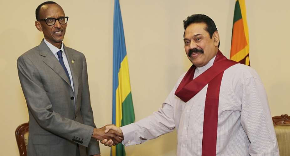 Sri Lankan Prime Minister Mahinda Rajapaksa right shakes hands with Rwandan President Paul Kagame left at the Commonwealth summit in Colombo, Sri Lanka in 2013.  - Source: Sri Lankan GovernmentGetty Images