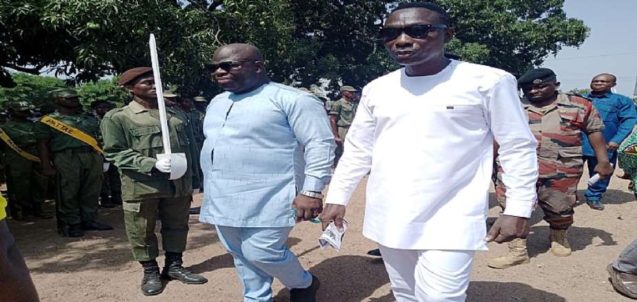 THE MCE (LEFT) FLANKED BY THE MUNICIPAL DIRECTOR OF EDUCATION INSPECTING THE PARADE