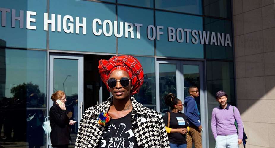 An activist poses for the camera outside Botswana High Court which ruled in favour of decriminalising homosexuality in June 2019. - Source: Tshekiso TebaloAFP via Getty Images