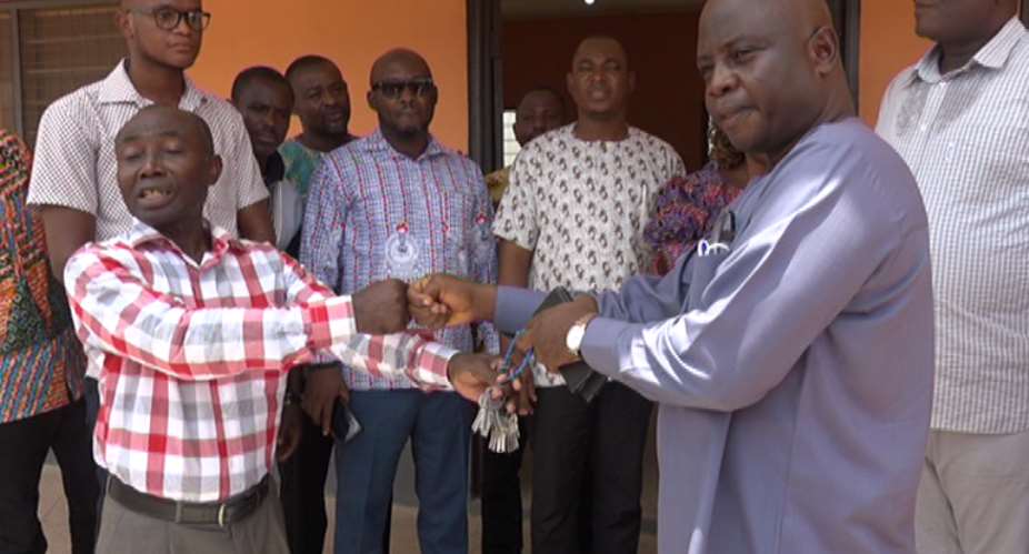 Handing over the keys of the facility to the Upper East Regional Minister Stehen Yakubu at Big Boss