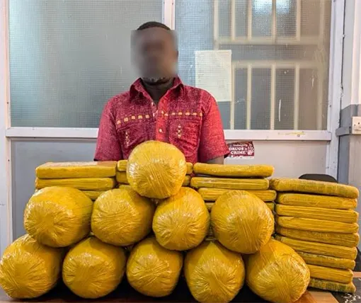 Suspect Foster Owusu with the suspected narcotics at the police station