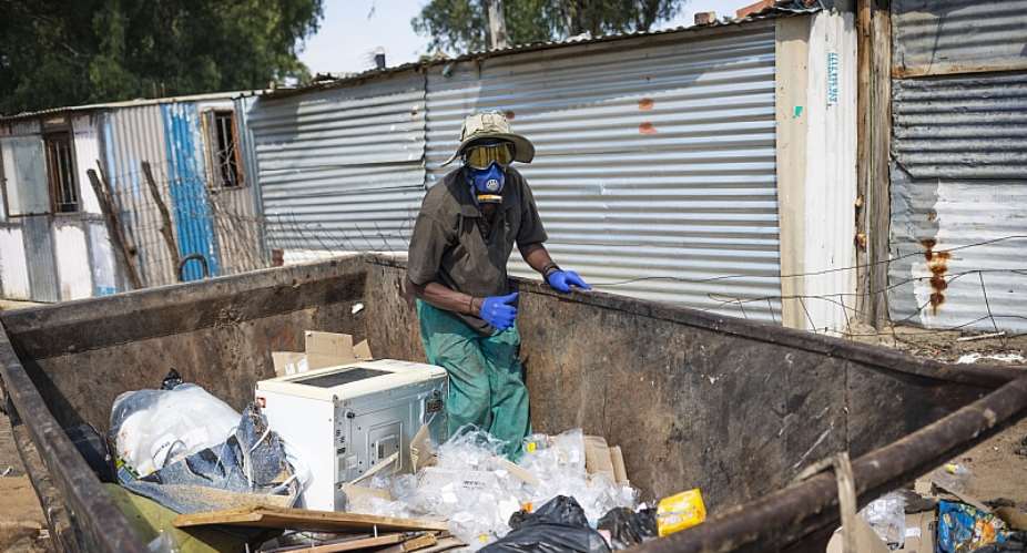 An unemployed man in Diepsloot, Johannesburg, collects trash for resale before South Africa went into a Covid-19 lockdown.  - Source: EFE-EPAKim Ludbrook