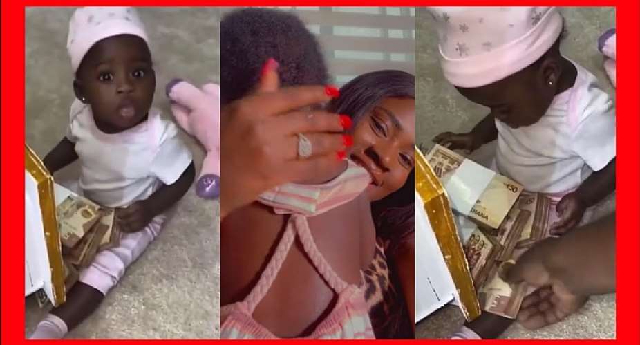 Fella Makafui splashes bundles of Ghc50 notes on her daughter, baby Island Frimpong Video
