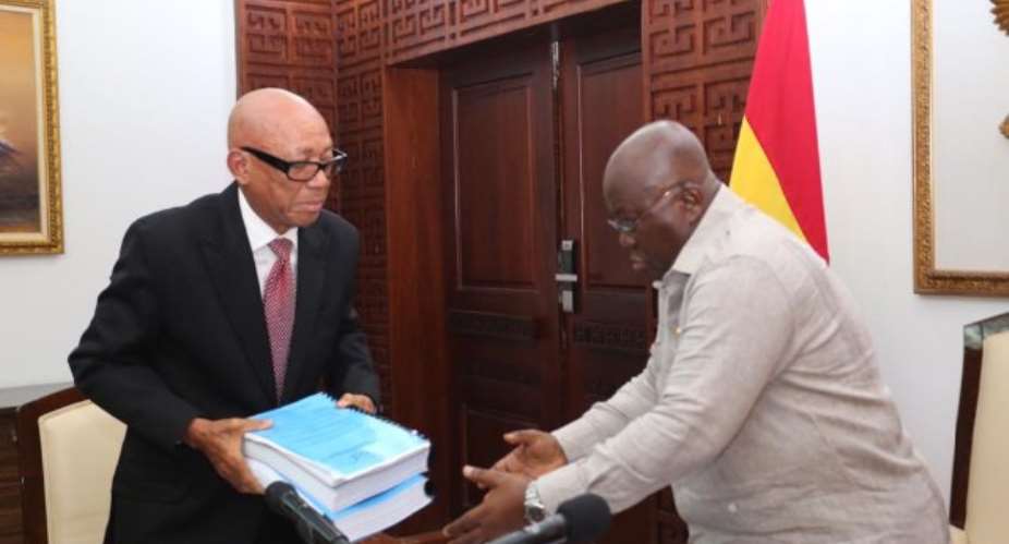 Emile Short chair of a three-member Commission of InquiryL presents report to the President, Nana Akufo-Addo, R