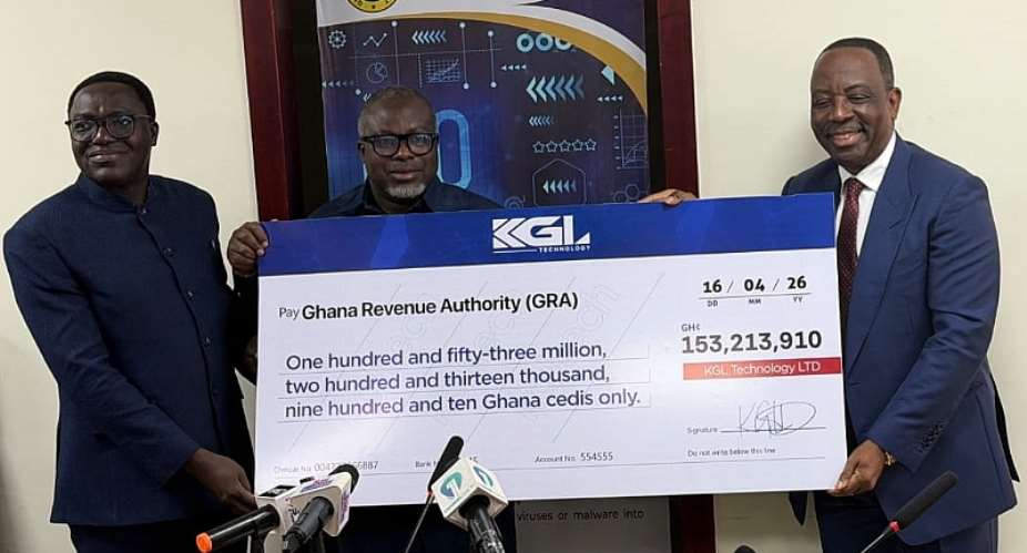 Executive Chairman of KGL Group, Alex Apau Dadey (left) presents the dummy cheque to GRA boss