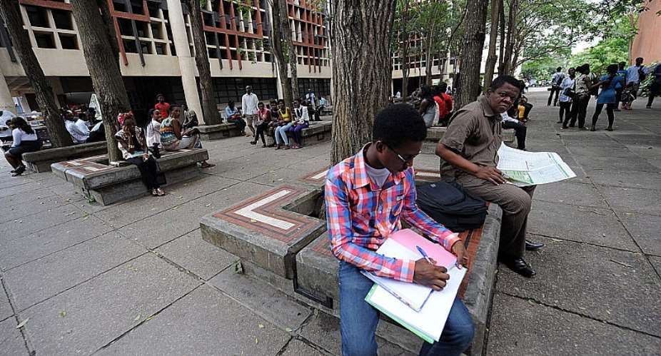 A student going through his work at the University of Lagos, Nigeria. - Source: Pius Utomi EkpeiAFPGetty