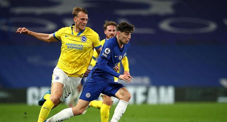 Kai Havertz of Chelsea runs with the ball under pressure from Dan Burn of Brighton and Hove Albion during the Premier League match between Chelsea and Brighton  Hove Albion at Stamford Bridge on April 20, 2021 in London, EnglandImage credit: Getty Images