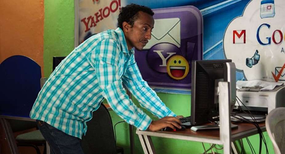 Internet cafe owner Kaleb Alemayehu checks a computer in Adama City, Ethiopia. Internet shutdowns are common. - Source: Solan KolliGetty Images