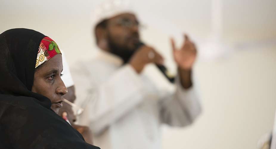 An Imam addresses a Kenyan Muslim Youth Alliance meeting flanked by community leaders.  - Source: Photo by Neil ThomasCorbis via Getty Images
