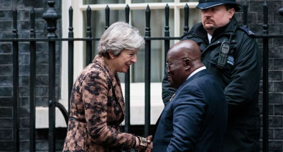 Theresa May in a handshake with President Akufo-Addo
