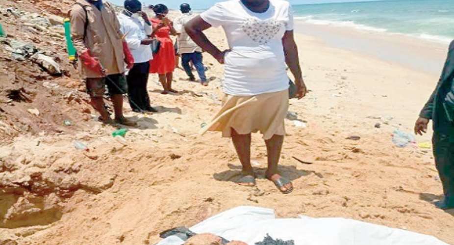 Larteley Mensah standing by the decomposed body of her daughter