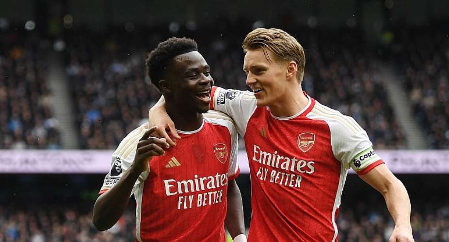 LONDON, ENGLAND - APRIL 28: Bukayo Saka and Martin Odegaard of Arsenal celebrate after an own goal by Pierre-Emile Hojbjerg of Tottenham Hotspur not pictured, Arsenal's first goal during the Premier League match between Tottenham Hotspur and Arsenal FCImage credit: Getty Images
