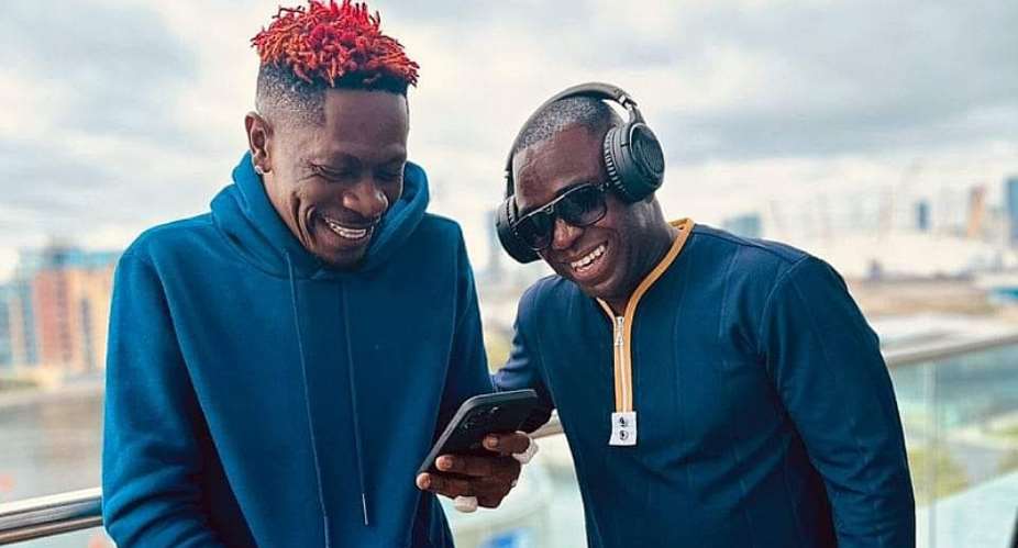 Shatta Wale left and his Manager, Sammy Flex
