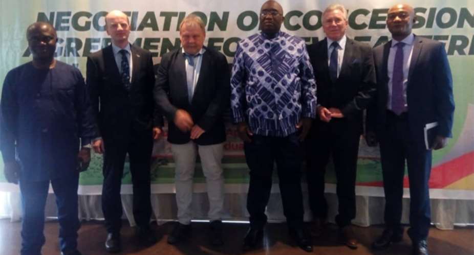 Joe Ghartey 3rd right in a photograph with the investors, Prof. Baffour and his deputy