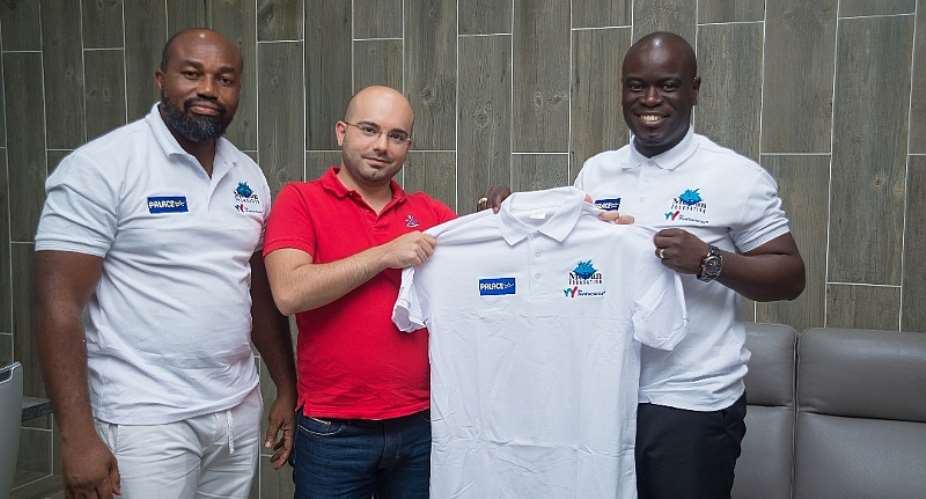 Ahmad Ezzedine CEO of Palace Decor2nd L and Attoh displaying one of the customized shirts for the tourney. With them is Dr. Daniel McKorley