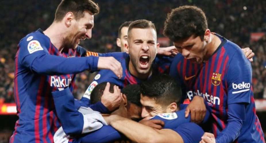 Barcelona's players celebrate Luis Suarez's opening goal against Atletico Madrid. Photograph: Pau BarrenaAFPGetty Images