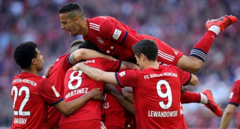 Mats Hummels celebrates with his teammates. Photograph: Alexander HassensteinBongartsGetty Images