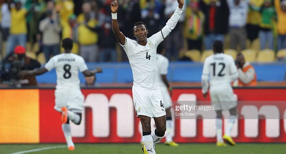 RUSTENBURG, SOUTH AFRICA - JUNE 19: John Pantsil of Ghana celebrates as Asamoah Gyan scores from the penalty spot during the 2010 FIFA World Cup South Africa Group D match between Ghana and Australia at the Royal Bafokeng Stadium on June 19, 2010 in Rustenburg, South Africa. Photo by Ezra ShawGetty Images