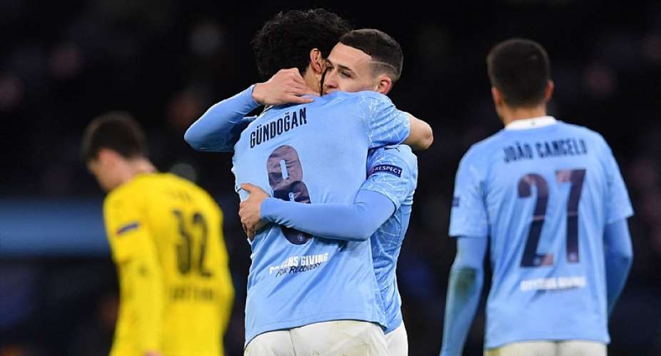 Manchester City's English midfielder Phil Foden 2R celebrates scoring his team's second goal with Manchester City's German midfielder Ilkay Gundogan during the UEFA Champions League first leg quarter-final football match between Manchester City and Borussia Dortmund.Image credit: Getty Images