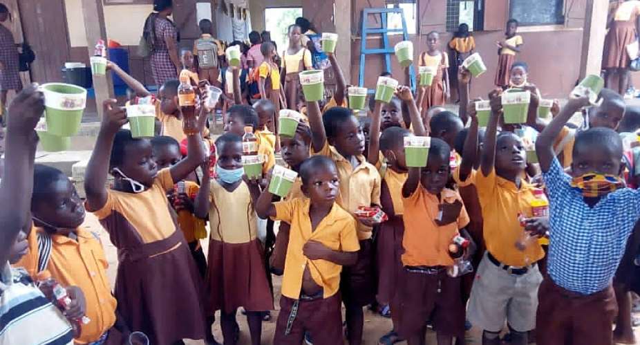 Another Basic School Teacher donates drinking cups to pupils