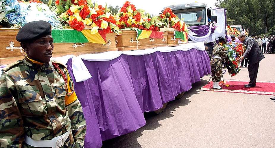 A lorry trailer carries the coffins of the victims of a  munitions explosion in Brazzaville, the Congolese capital, in 2012.  - Source: Junior D. KannahAFP via Getty Images