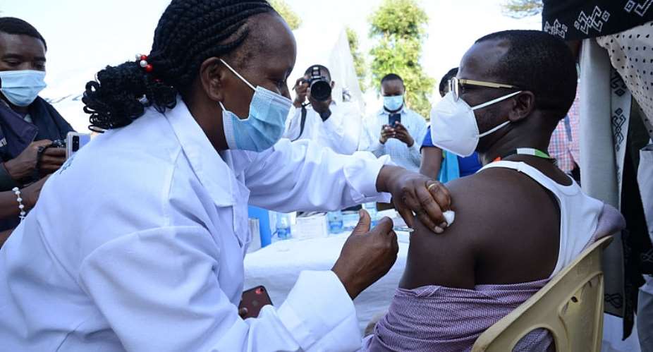 A healthcare worker administers an OxfordAstraZeneca COVID-19 vaccine to her colleague at Mutuini Hospital in Nairobi. Kenya on March 3, 2021 - Source: Photo by Dennis SigweSOPA ImagesLightRocket via Getty Images