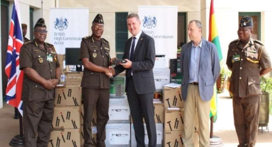 British High Commissioner to Ghana, Iain Walker, making the donation