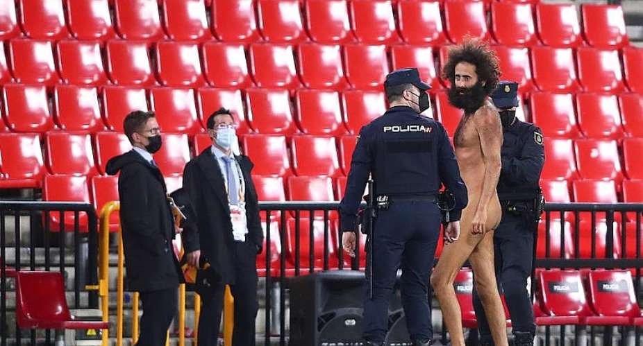 A streaker is being apprehended by the police  Getty Images