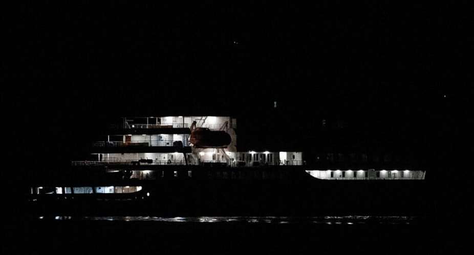 The Dutch-flagged hantavirus-stricken cruise ship MV Hondius sails near El Medano, Tenerife, in the Canary Islands, Spain early on May 10, 2026. - AFP - JORGE GUERRERO