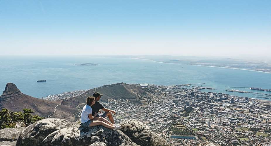 A couple taking in the view from Table Mountain, Cape Town. - Source: Getty Images