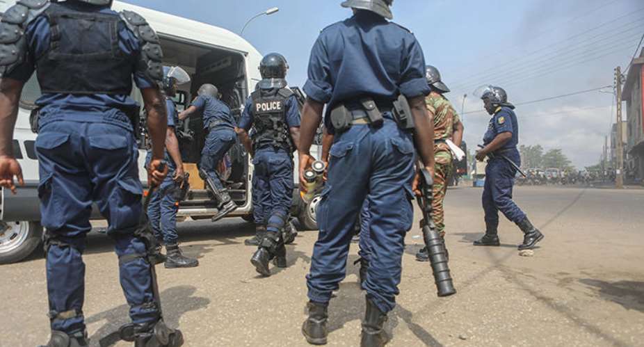 Police officers are seen in Cotonou, Benin, on March 9, 2018. Beninese authorities recently launched a fake news investigation into Casimir Kpedjo, editor of the privately owned daily Nouvelle Economie. AFPYanick Folly