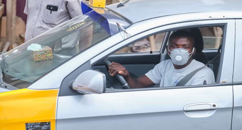 Yilo Krobo: Police Commander, Team Enforce Mandatory Face Mask Wearing On Taxi Drivers