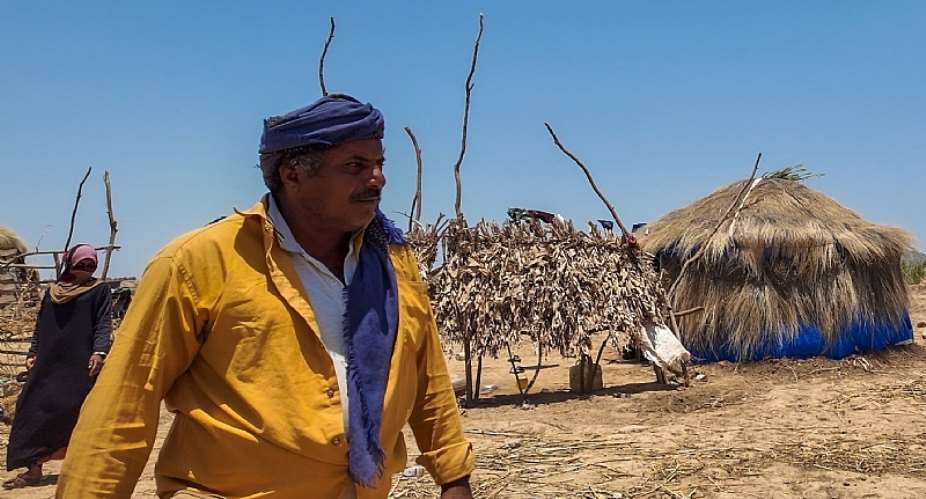 Naser, a displaced father from Zabid and a shepherd in Al Nakhla Valley, walks through the higher ground settlement where his family relocated after the floods. Photo: IOM 2026/Haithm Abdulbaqi
