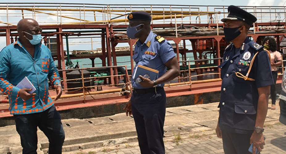 Thomas Alonsi sharing a thought with Cdr Kwafo and DCOP Iddi Seidu