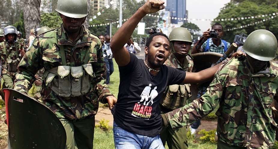 Kenyan activist Boniface Mwangi is arrested during a protest in Nairobi in 2014.  - Source: AFP via Getty Images