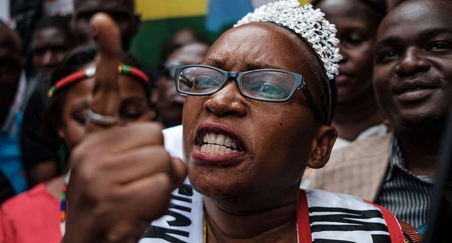 Ugandan activist and writer Stella Nyanzi outside a Kampala court after a ruling in her favour against President Yoweri Museveni  - Source: Sumy SadurniAFP via GettyImages