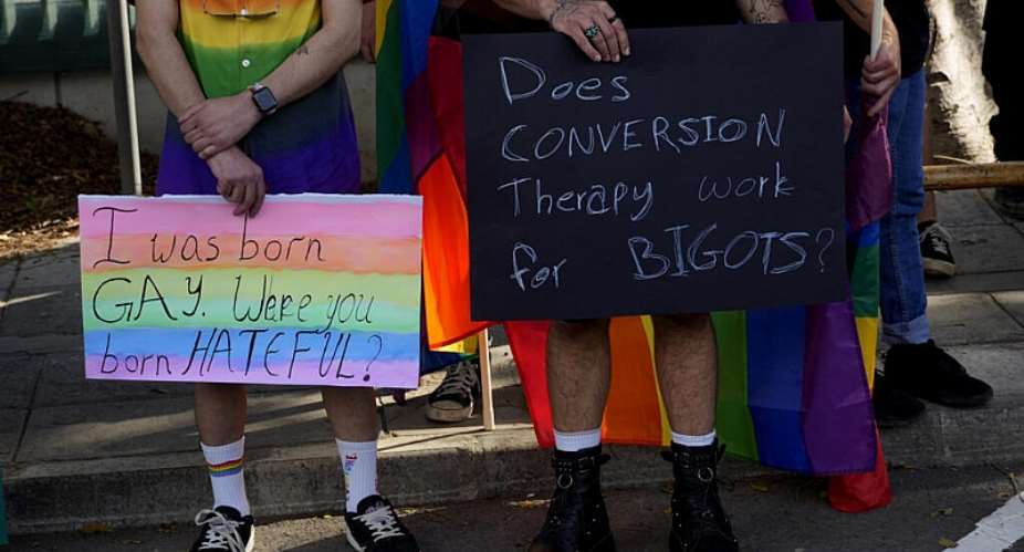 Demonstrators protest against conversion therapy outside parliament in Nicosia, Cyprus, on 25 May 2023. The European Union has ruled out pursuing a bloc-wide ban on the practice. -  AP - Petros Karadjias