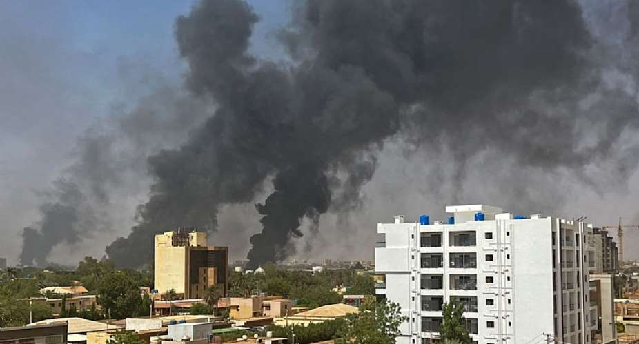 Smoke billows above residential buildings in Khartoum, Sudan, in April 2023.  - Source: AFP via Getty Images