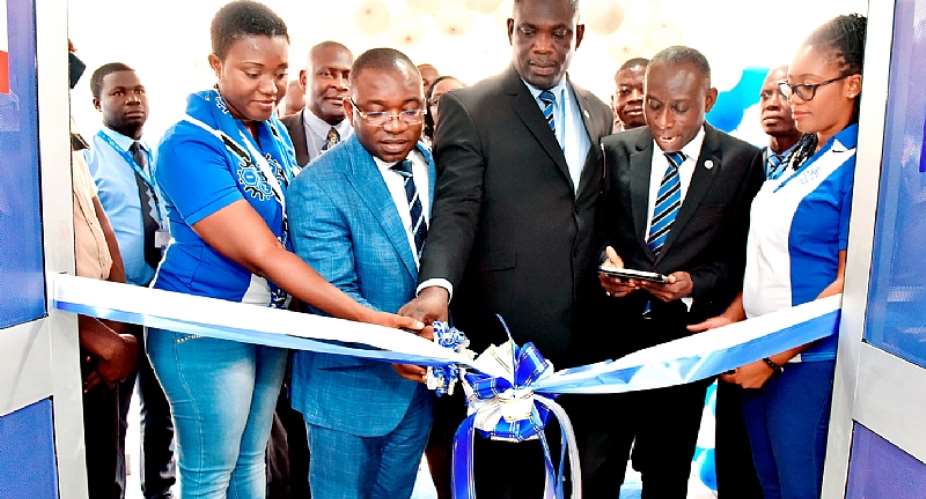 Officials cutting the tape to officially open the Accra-New Town Branch