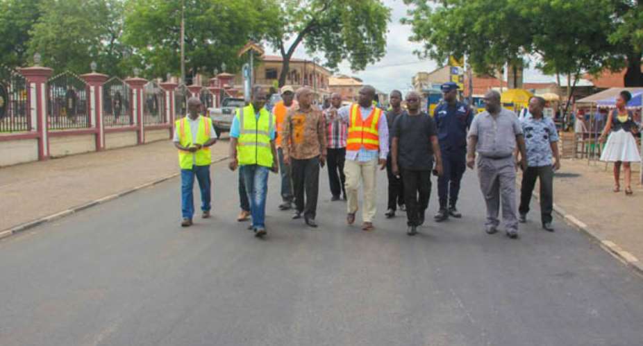 Osei Assibey Antwi and Ing Nana Poku Agyeman inspecting road works in the Manhyia South Constituency