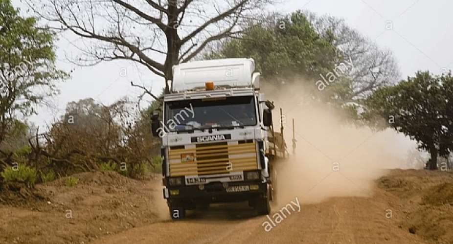 some vehicles on dusty road at Gambaga in North East